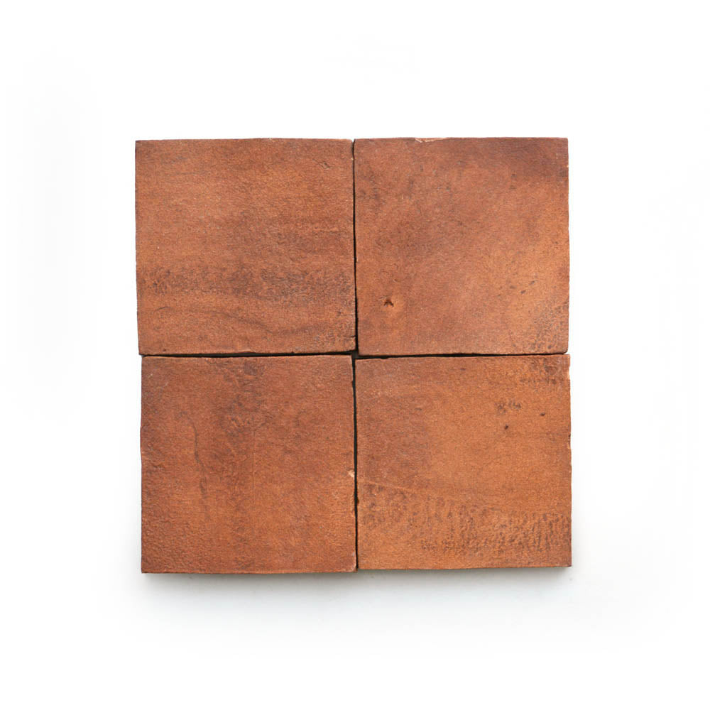 Four 4x4 Square + Red Clay tiles by Zia Tile arranged in a 2x2 grid on a white background, evoking classic San Miguel de Allende terra cotta craftsmanship.
