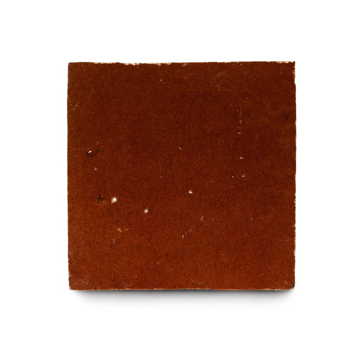 A single Burnt Sugar 4x4 piece, inspired by Moroccan tile, is shown on a white background. Its brown surface is smooth with minimal white specks and slightly rough edges.
