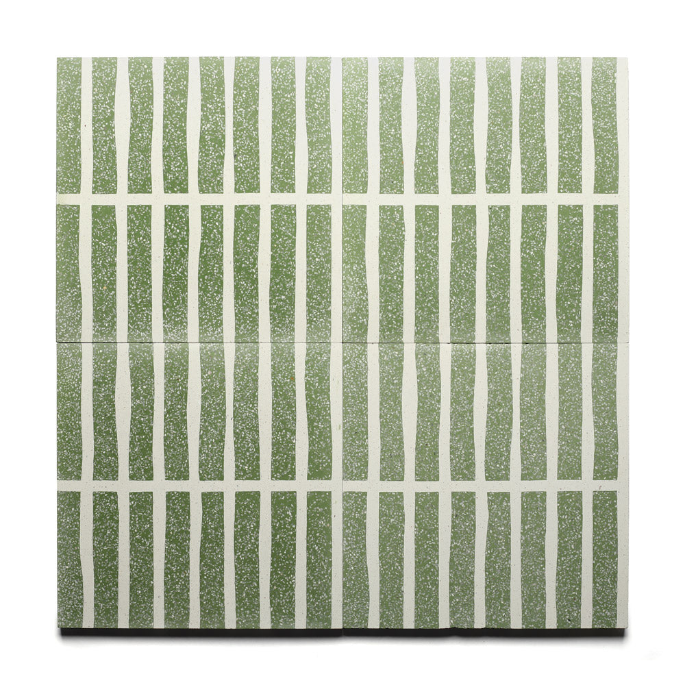 The Collins Saguaro 12x12 tile by Zia Tile features a terrazzo cement surface with wavy green vertical and straight white horizontal lines, forming an abstract geometric grid pattern.