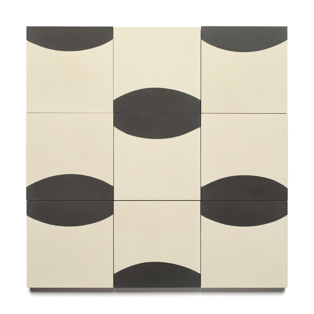The Coupe Black 4x4 by Zia Tile features nine cream handmade tiles, each with a black semicircle in varying orientations, forming an abstract geometric pattern.
