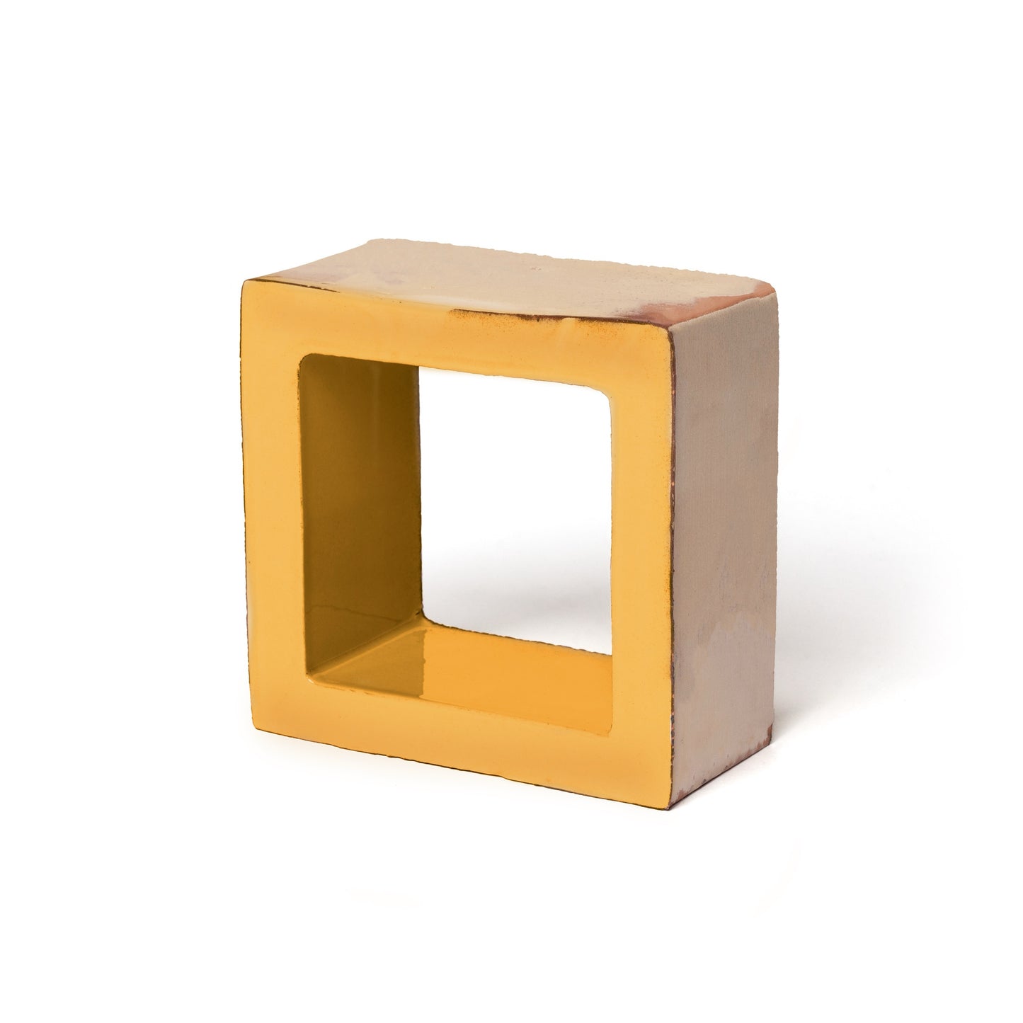 A yellow, square Cube + Vega tile by Zia Tile stands upright on a white background. Its glossy surface, hollow center, and softly rounded edges emphasize the distinctive 3D sculptural design.