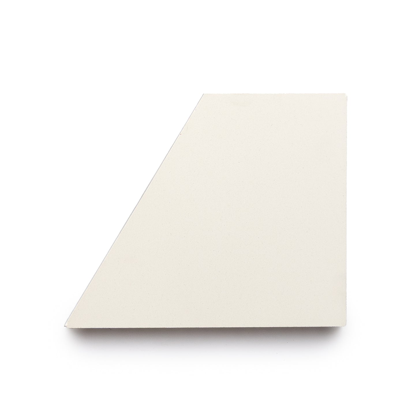 A single Derby Gypsum + Cotton trapezoidal ceramic tile by Zia Tile, cream-colored with a matte finish, shown on a white background.