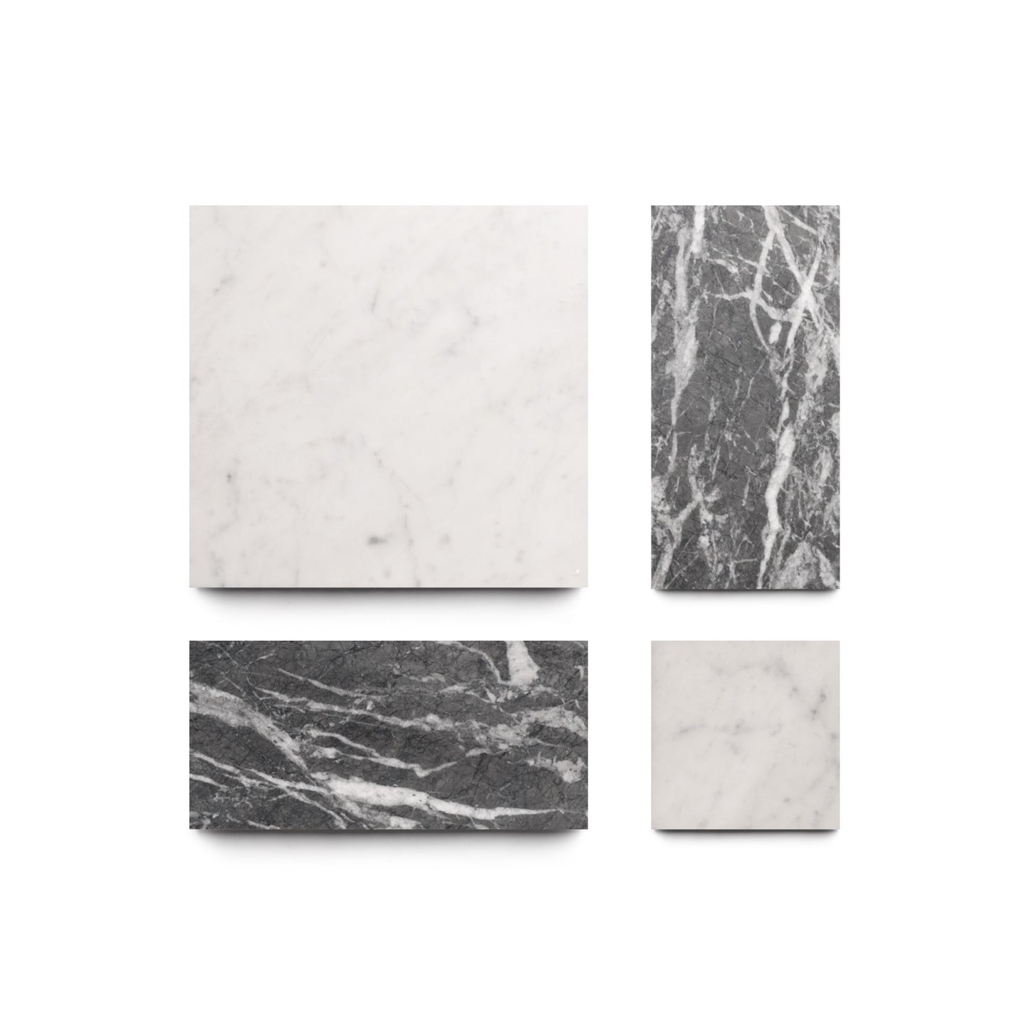 Four rectangular Etna in Carrara + Grigio Carnico tiles by Zia Tile are arranged on a white background; two feature subtle gray-veined white marble, while two display bold white veining on dark gray, creating a striking decorative effect.