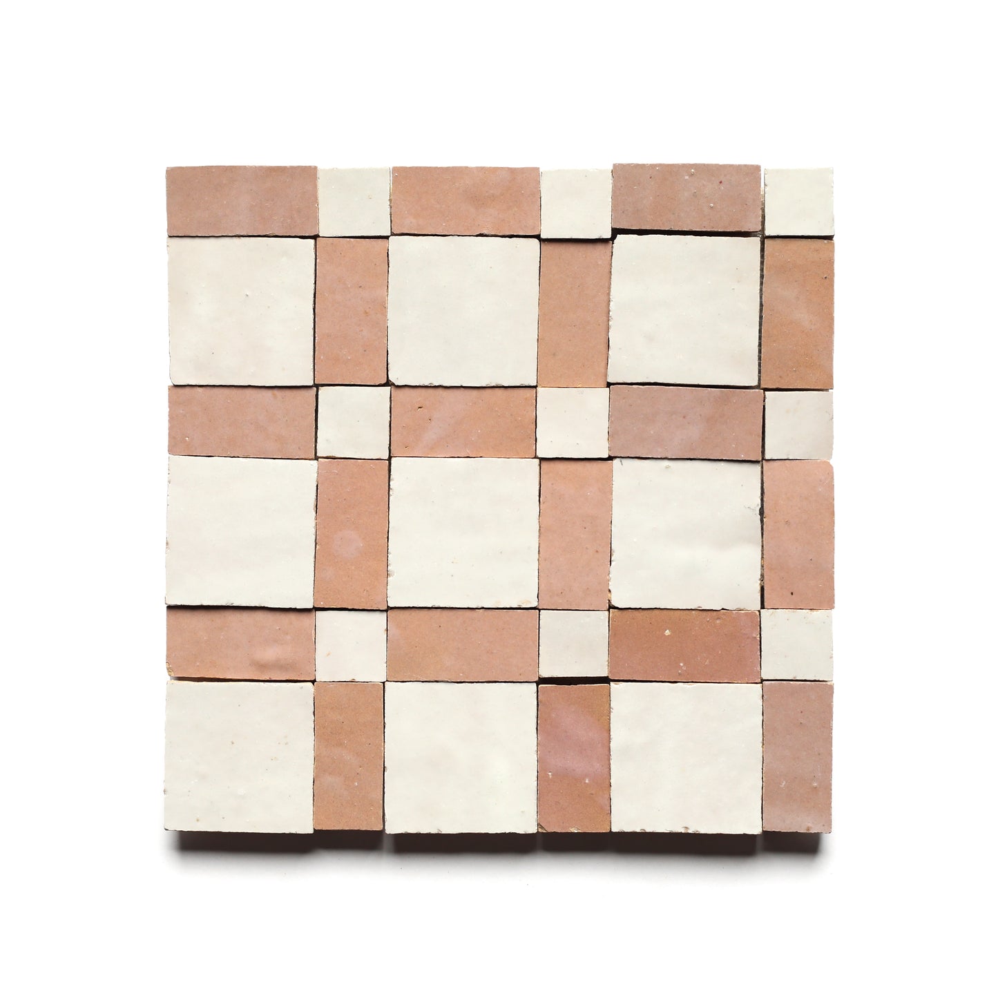 The Gambit 3 by Zia Tile is a square mosaic tile featuring a checkerboard pattern of alternating light beige and light brown tiles set in a geometric grid on a white background.
