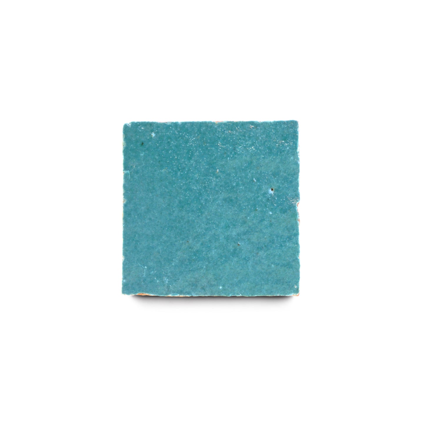 A single Glacier Blue 2x2 zellige tile by Zia Tile, featuring a teal hue and slightly rough texture, is centered on a white background.
