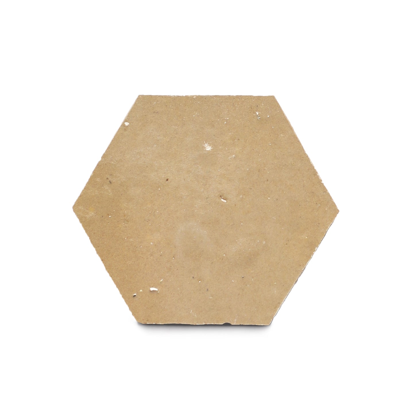 A single beige Glazed Earth Hex tile with a smooth, matte surface and minor chips—ideal for a kitchen backsplash inspired by zellige tiles—isolated on a white background.