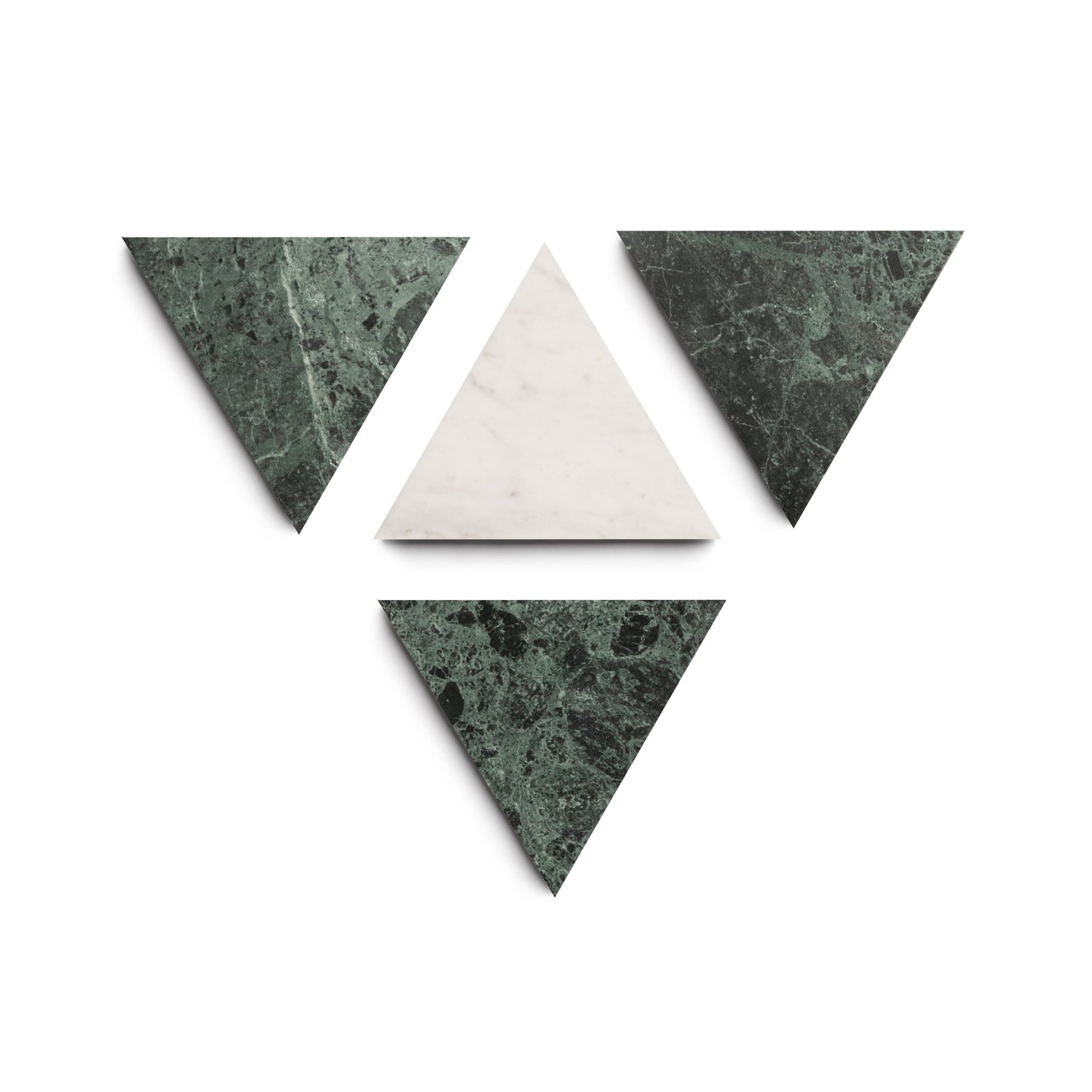 Four marble triangles—one white Carrara at the center, surrounded by three Verde Alpi green triangles—form an abstract Zia Tile Isola cement tile pattern on a white background.