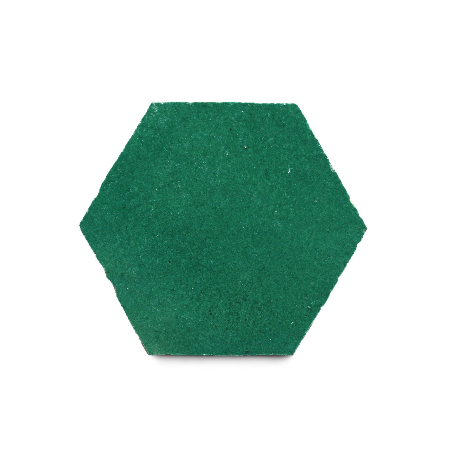 The Jade Hex is a green, hexagon-shaped zellige tile with a textured surface, ideal for creating a Moroccan-inspired kitchen backsplash. Shown here against a white background.