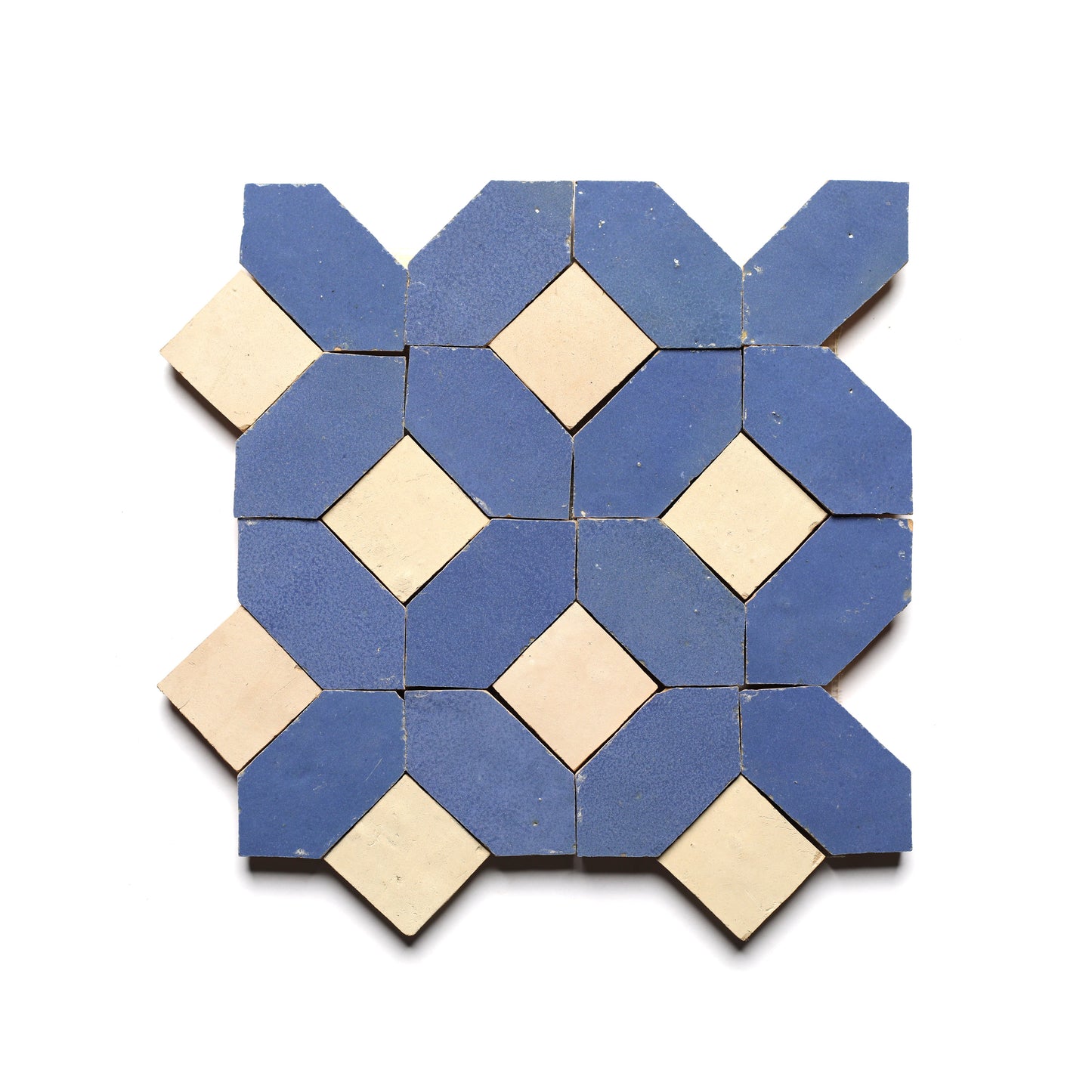 The Lattice 3 tile by Zia Tile features a geometric pattern with alternating blue octagons and beige squares, inspired by Moroccan designs and arranged in a symmetrical mosaic. Ideal for creating a striking kitchen backsplash.