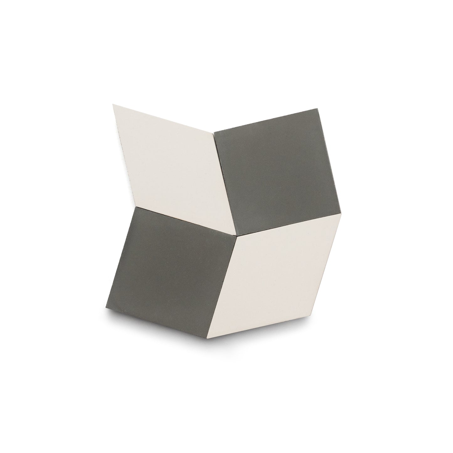 Madrid Ash + White by Zia Tile features six flat panels in alternating white and dark gray, creating a handmade, geometric cube illusion with a bold 3D effect against a white background.