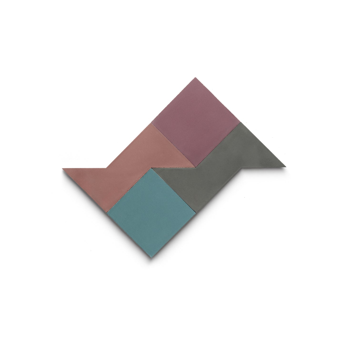 The Manolo Set Three by Zia Tile features four handmade geometric tiles in pink, mauve, gray, and teal, arranged in a zigzag parallelogram with pointed ends on a white background.