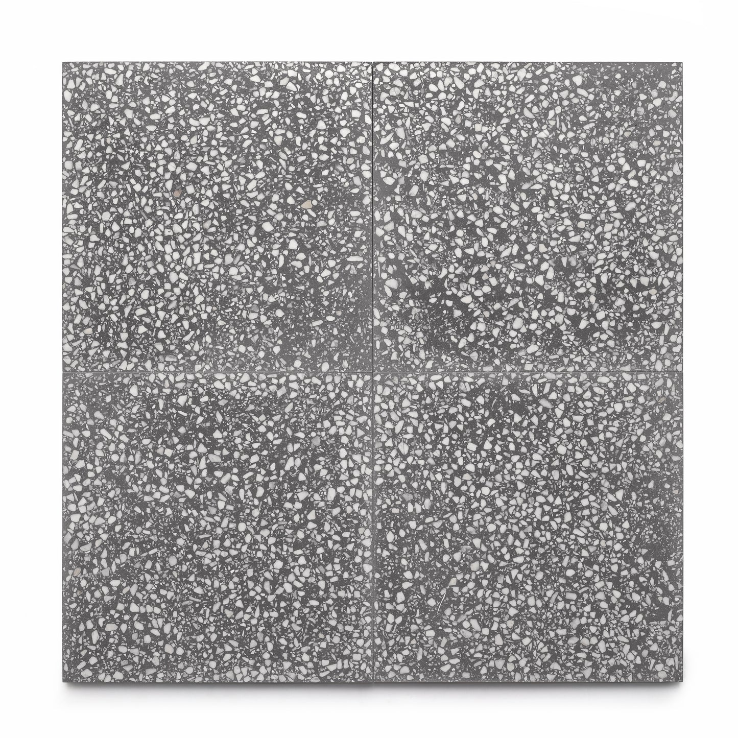 Zia Tiles Oscar 12x12: four dark gray terrazzo cement tiles, each with white and light gray stone chips—perfect for cement flooring or a stylish kitchen backsplash.