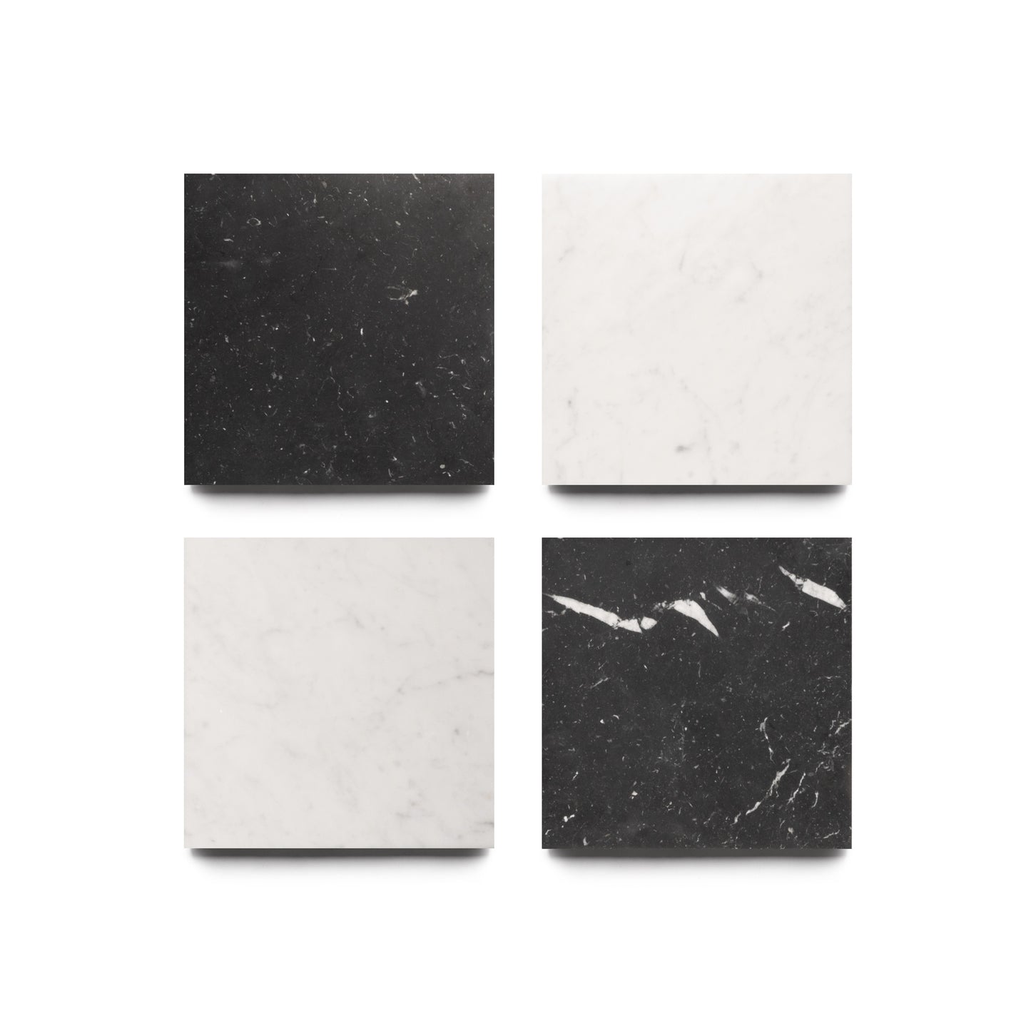 Four Piazza in Carrara + Nero Marquina tiles by Zia Tile, arranged 2x2: black with white veining (top left, bottom right), white with gray veining (top right, bottom left), all set on a white background.