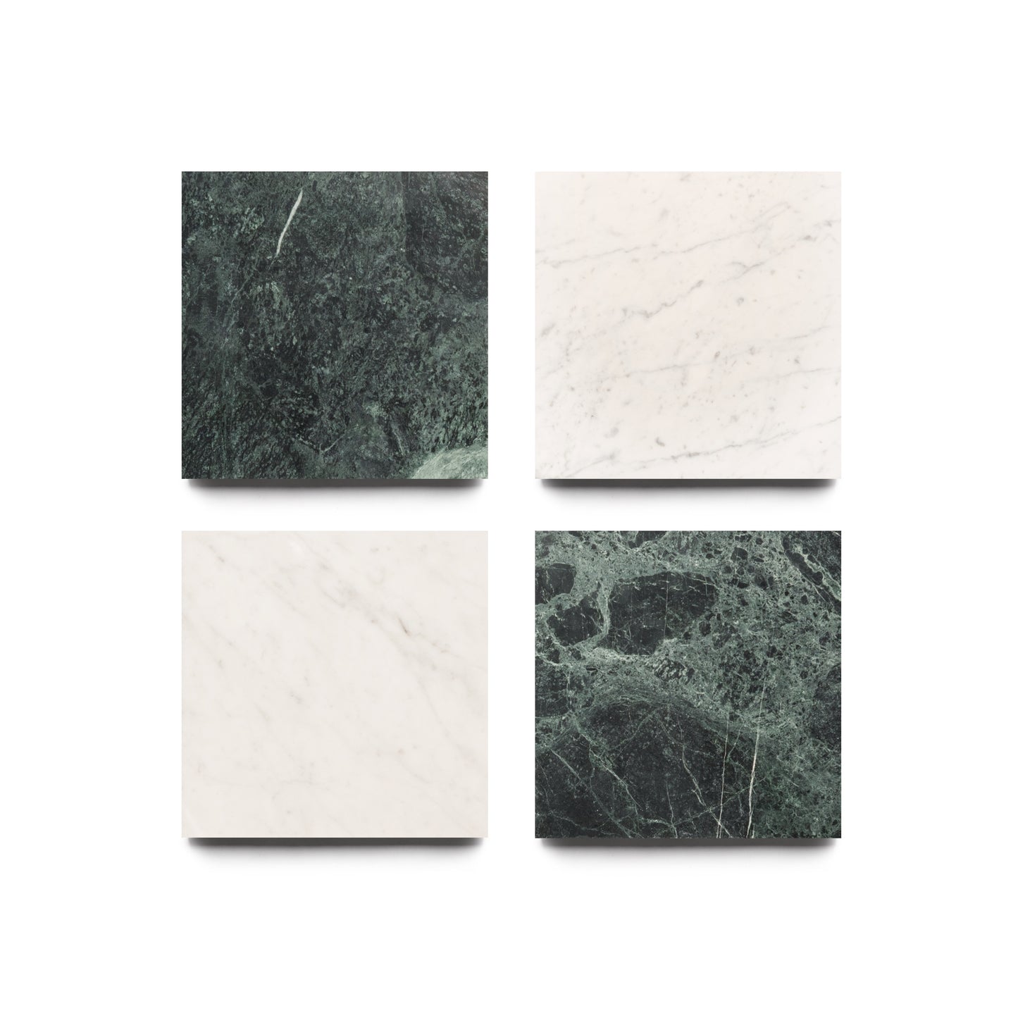Four square tiles—two dark green (Verde Alpi) in the top left and bottom right, and two white with grey veining (Carrara) in the top right and bottom left—by Zia Tile, Piazza collection.