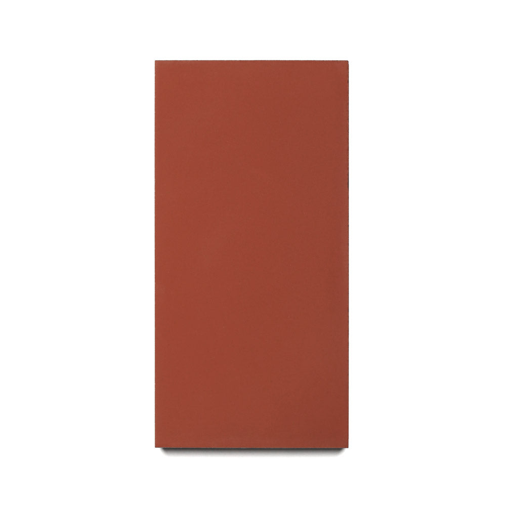 The Zia Tile Pompeii 4x8 features a rectangular red-brown cement design with a smooth, untextured surface and sharp edges, shown on a plain white background—perfect for creating a stylish kitchen backsplash.