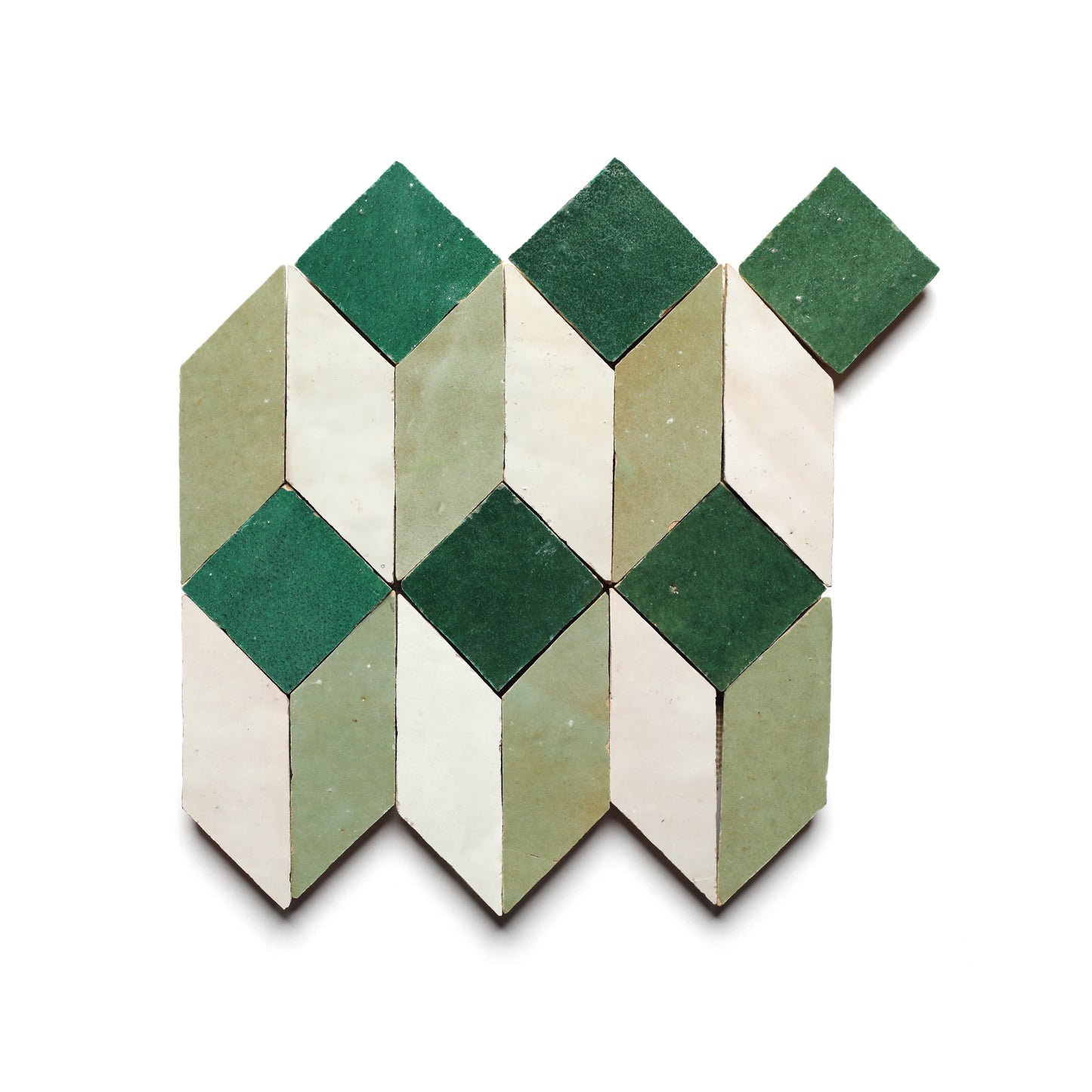 Prismatic 4 by Zia Tile features a geometric pattern of green, white, and beige mosaic zellige tiles in repeating diamond and parallelogram shapes—ideal for creating a standout kitchen backsplash.