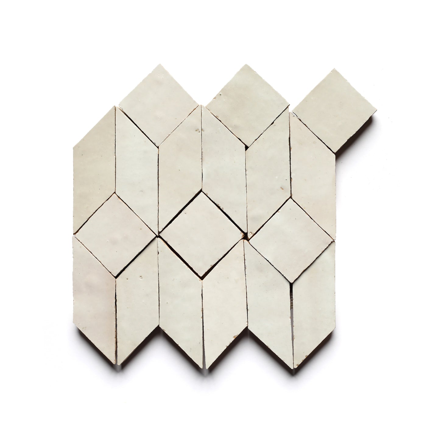 Prismatic 1 by Zia Tile features a geometric pattern of white diamonds and parallelograms, inspired by Moroccan designs—ideal for creating a striking kitchen backsplash.