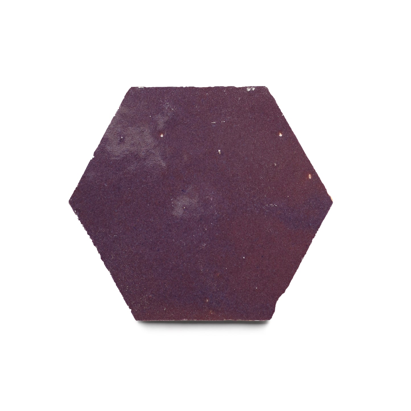 The Purple Iris Hex features a matte, deep purple surface and slightly rough edges—ideal as a Moroccan tile accent for your kitchen backsplash. Shown here: a single tile against a white background.