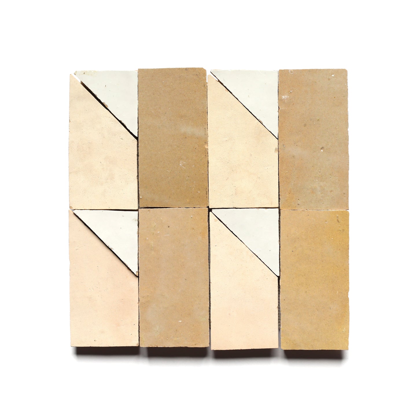 Six Radian Inline 4 tiles by Zia Tile, arranged in two rows of three, feature diagonal beige and off-white sections that recall a subtle Moroccan style—an ideal modern kitchen backsplash on a white background.