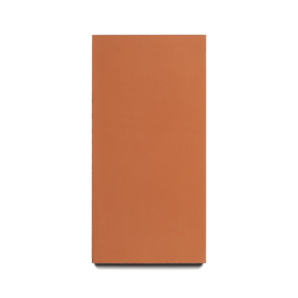 The Zia Tile Rust 4x8 is a rectangular, flat, reddish-brown cement tile shown on a white background—perfect for creating a modern kitchen backsplash or durable cement floor.