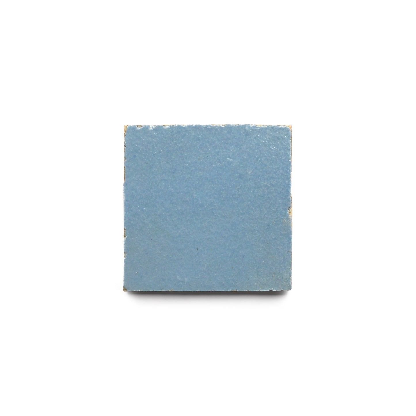 The Superior Blue 2x2 features a small, square design with slightly rough, uneven edges on a white background, highlighting the artisanal charm of authentic Moroccan zellige tile in a compact format.