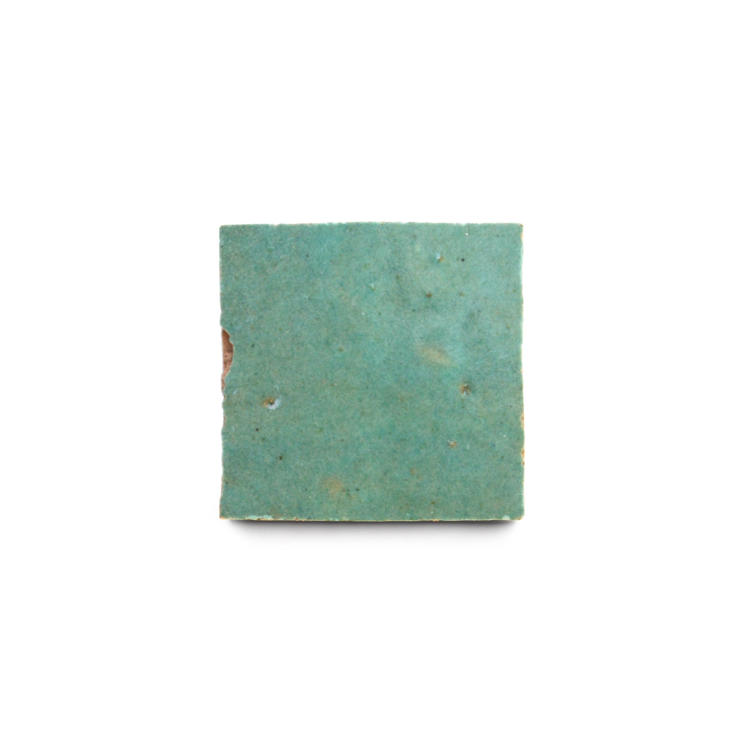 A Tidepool 2x2 zellige, square and turquoise-colored with a rough textured surface, displayed on a white background.