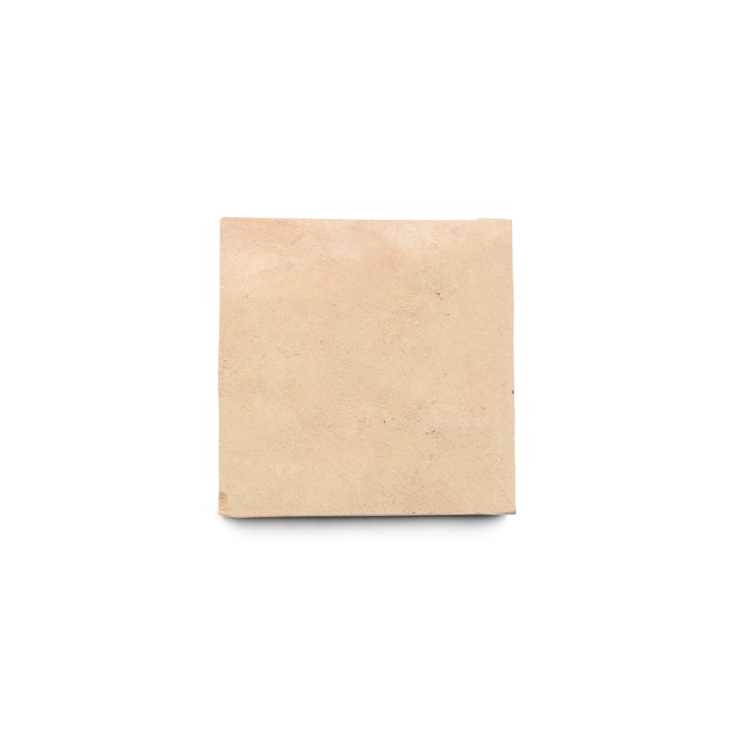 A single Unglazed Natural 2x2 Zellige tile with a slightly rough, unglazed finish is centered on a plain white background, highlighting the artistry of classic Moroccan tile craftsmanship.