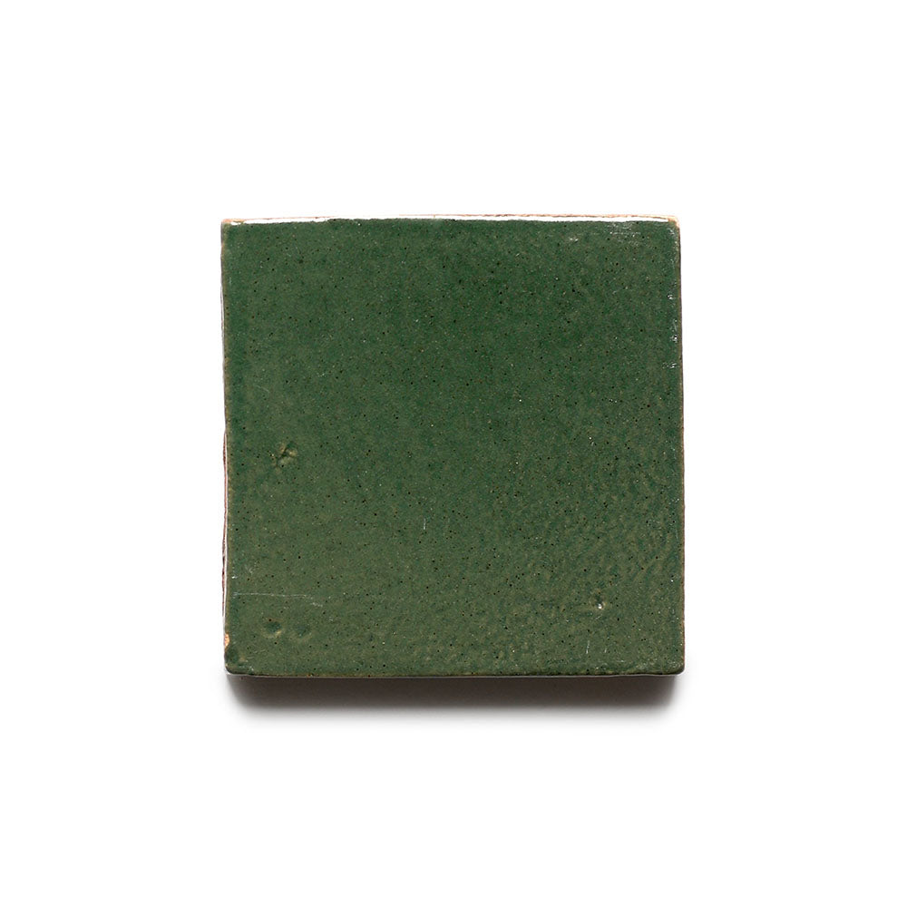 The Valverde 4x4 by Zia Tile is a single square ceramic tile with a glossy dark green finish, made from high-fired Cotto and shown against a white background.
