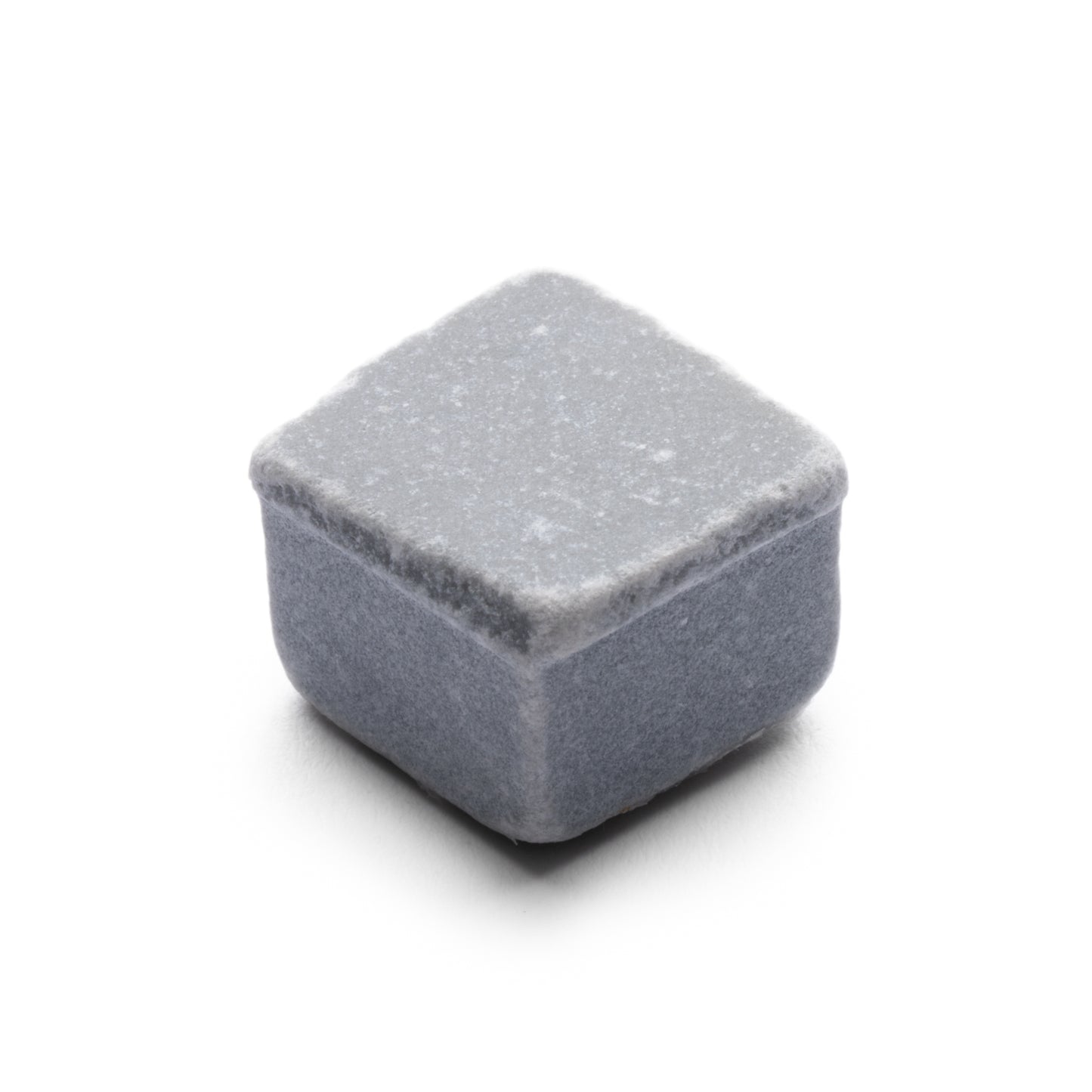 The Ventaglio in Bardiglio Imperiale by Zia Tile is a single gray whiskey stone with a soft, matte texture and rounded edges, shaped like a small cube, shown on a white background.