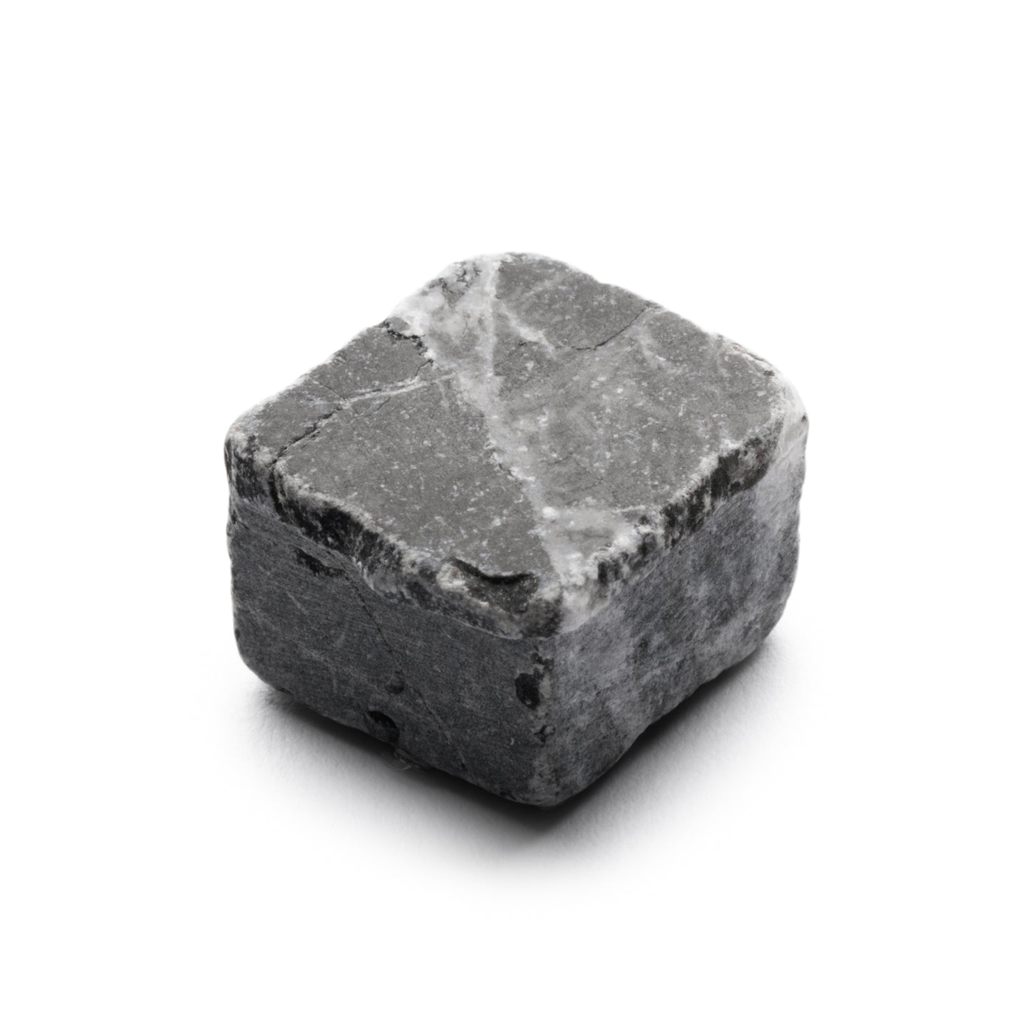 The Ventaglio in Grigio Carnico by Zia Tile, a roughly square gray tile with white streaks, is displayed on a plain white background.