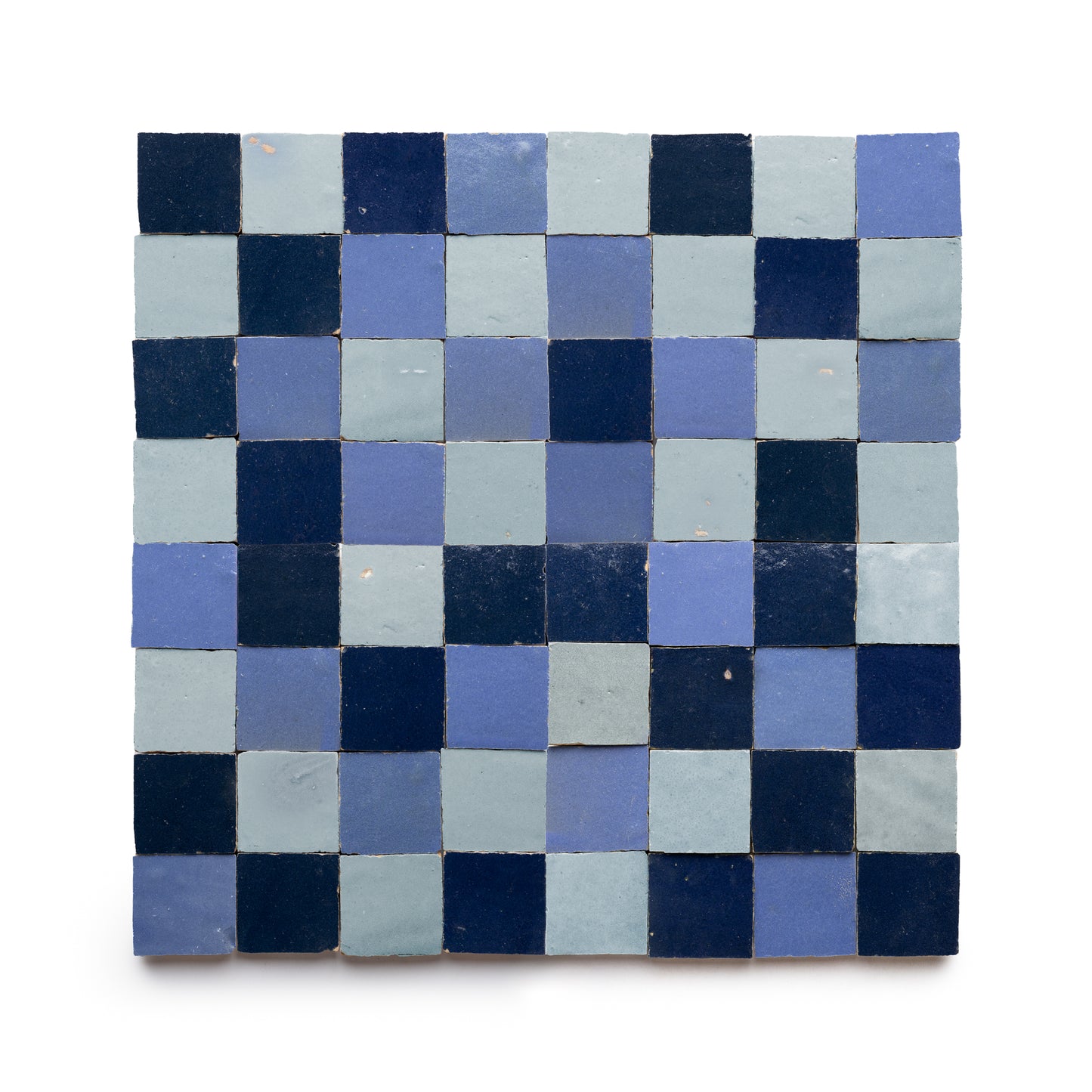 The Night Blue + Skylight + Portuguese Blue Checkerboard by Zia Tile features a square grid of 2x2 blue zellige tiles in varied shades and a checkerboard pattern. Slight unevenness highlights the handmade, Moroccan-inspired charm.
