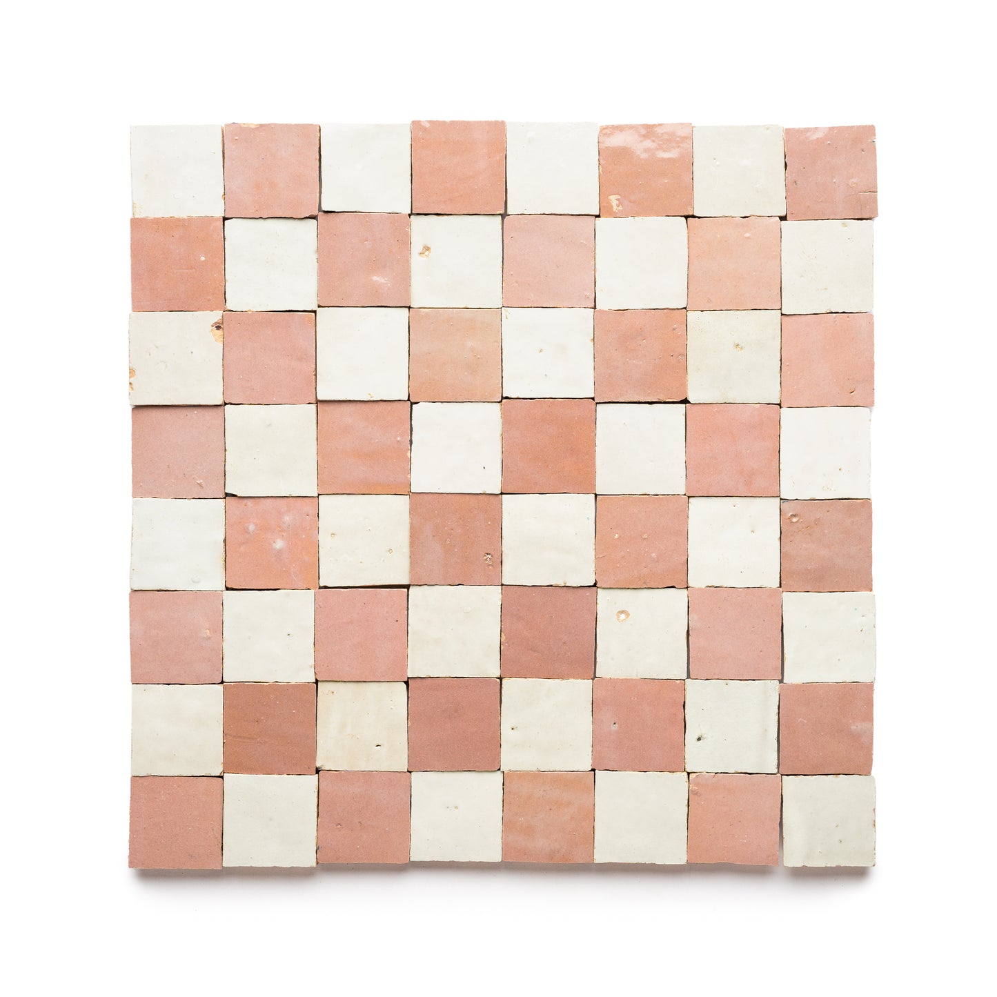 The Desert Bloom + Casablanca Checkerboard by Zia Tile is a square mosaic featuring alternating light pink and off-white 2x2 zellige tiles in an even checkerboard pattern on a white background.