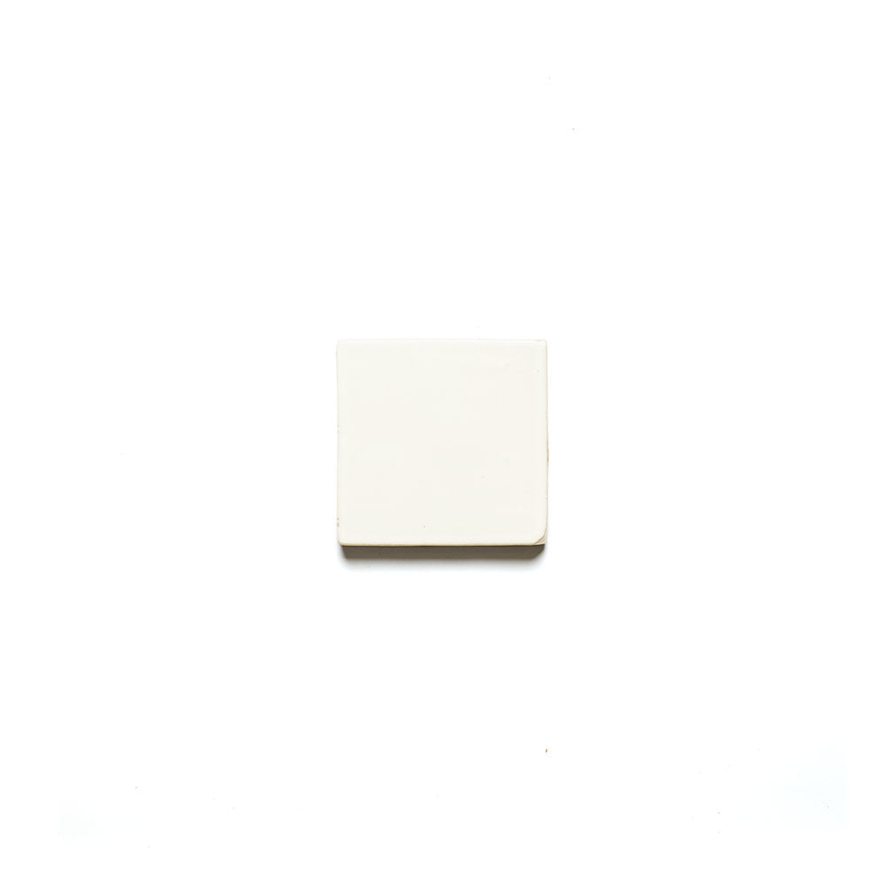 The Albar 4x4 by Zia Tile, a rectangular white tile with a handmade feel, is centered against a plain white background.
