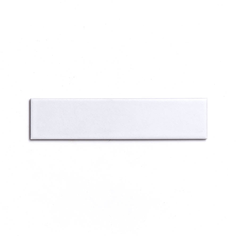 The Zia Tile Alpha White 2x8 features a rectangular matte ceramic design on a plain white background, ideal for modern spaces seeking architectural grade tiles.