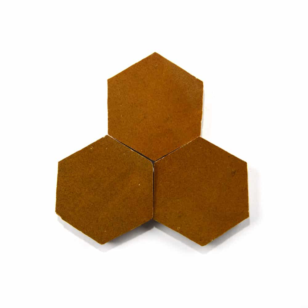 Three Amber Hex, Sample tiles by Zia Tile, in a brown handmade hexagonal design, are arranged with edges touching to form a compact triangular cluster on a white background.