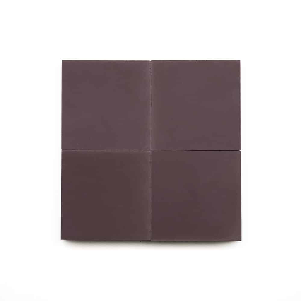 Four plain dark chocolate squares, inspired by the Aubergine 4x4 tile, are arranged in a 2-by-2 grid on a white background.