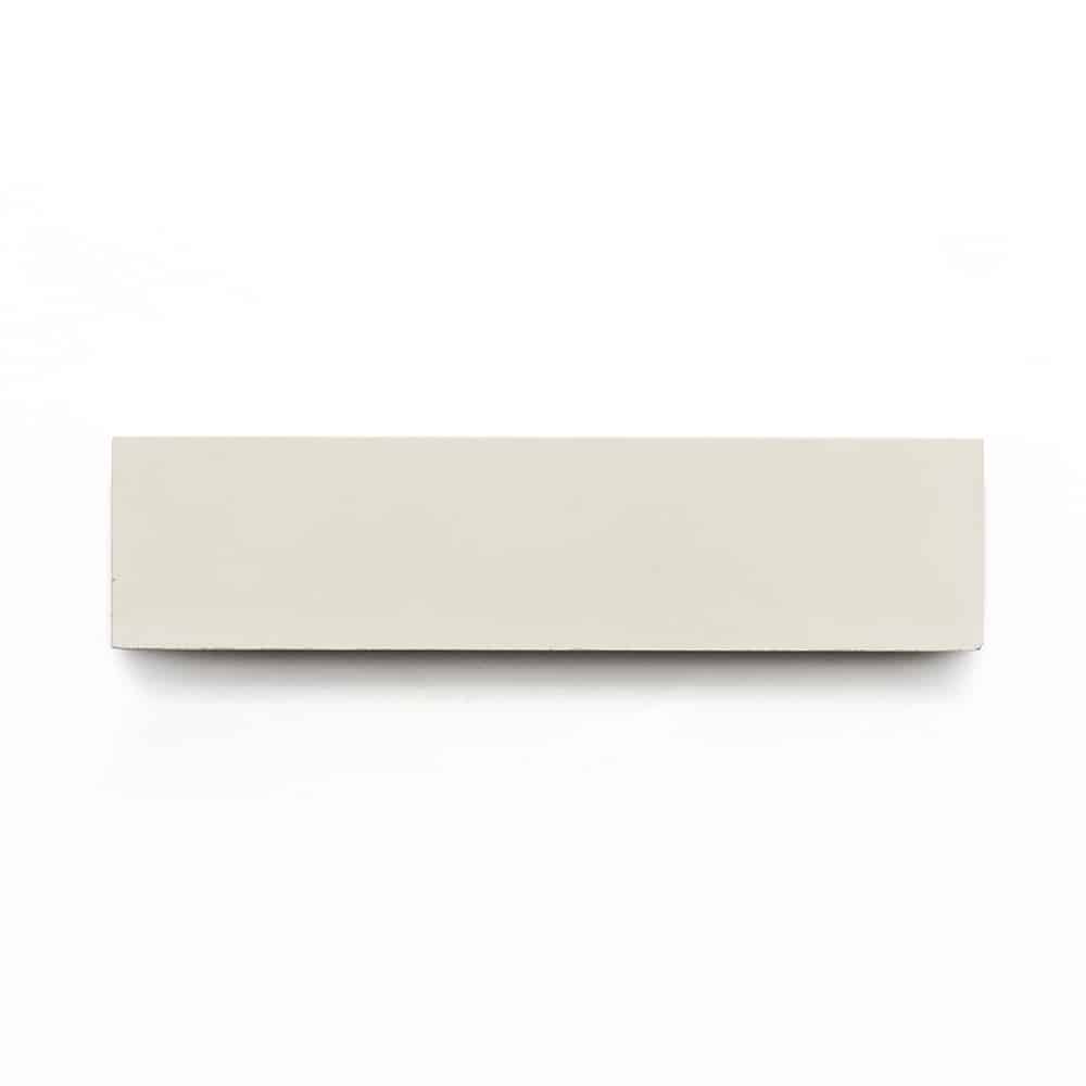 The Bone 2x8, a rectangular white tile with a plain design inspired by subway tiles, is displayed against a white background.