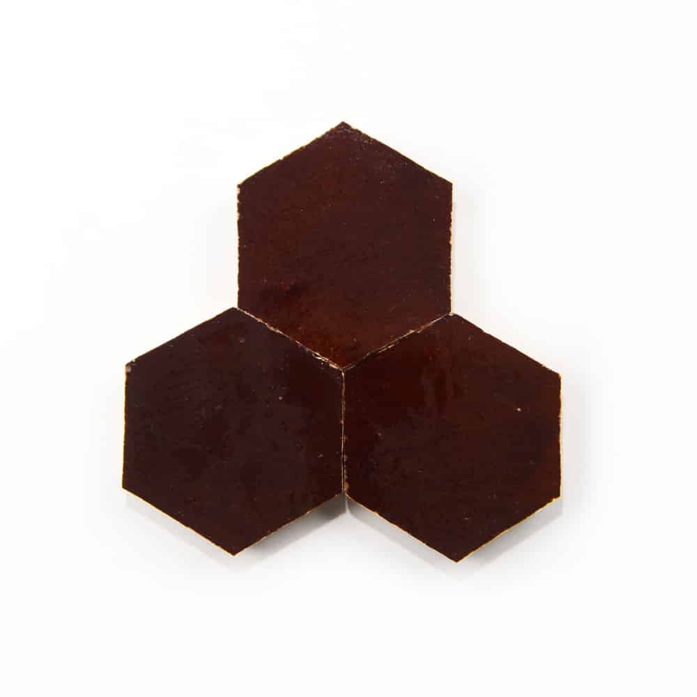 Three Burnt Sugar Hex, Sample tiles by Zia Tile, dark brown and hexagon-shaped, are arranged edge-to-edge in a triangular formation on a white background.