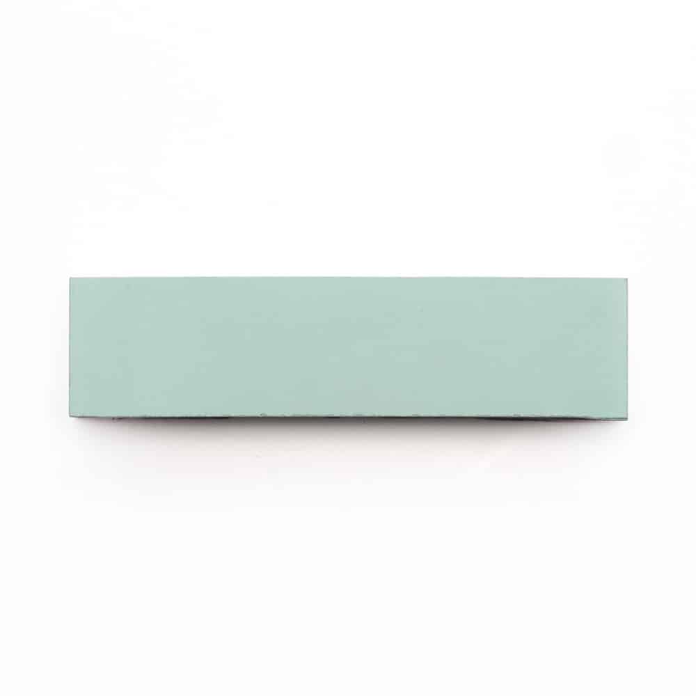 The Celadon 2x8 is a rectangular, flat light green subway tile shown from above against a plain white background.