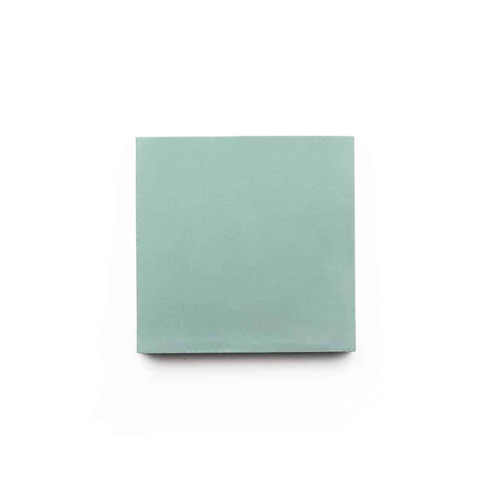 A single, square-shaped, light blue sticky note is centered on a white background, echoing the clean lines and soft hues of the Celadon 4x4, Sample by vendor-unknown.