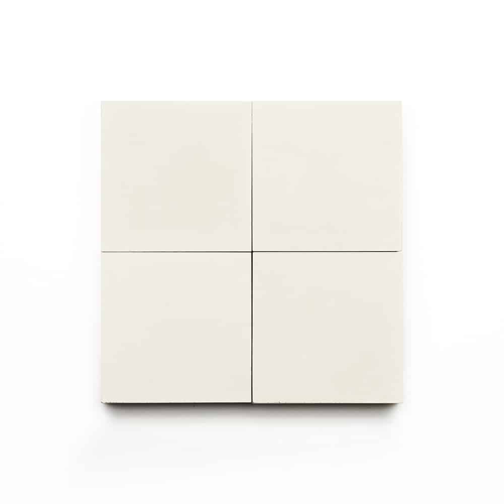 Four Cotton 4x4 off-white, square tiles are arranged in a two-by-two grid on a white background—ideal for creating a clean, modern kitchen backsplash.