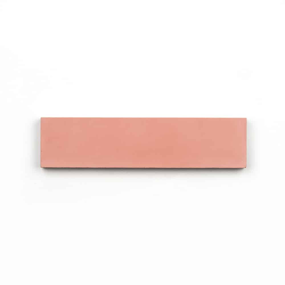 A rectangular, flat, pink eraser on a white background matches the soft pastel shade of Delta Moon 2x8 tile, popular for modern kitchen backsplashes.