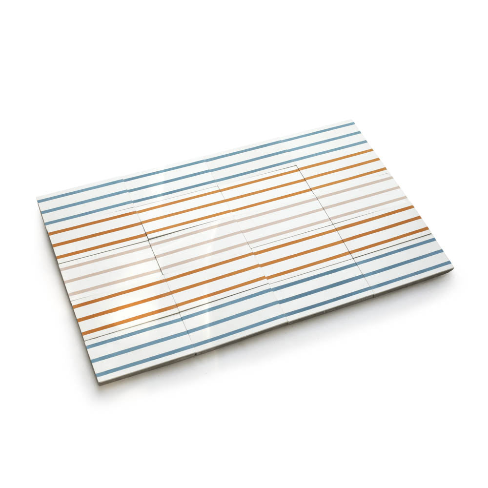 Rectangular tray with a white surface, featuring evenly spaced horizontal blue and orange stripes reminiscent of High Line Jaipur Pink 4x8 tile, photographed on a white background.