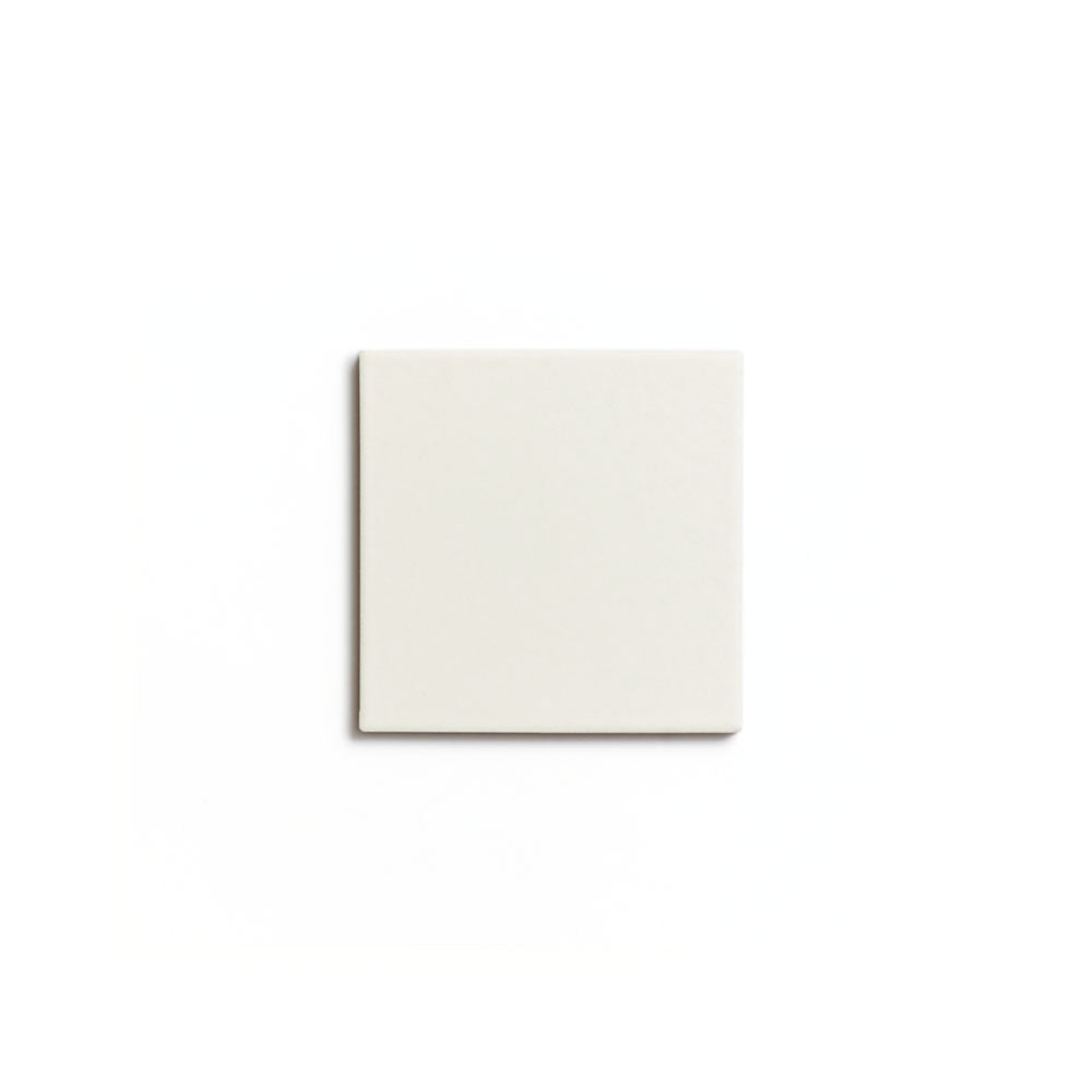 A single Linen 4x4 matte ceramic tile by Zia Tile in plain light beige is shown from above on a white background.