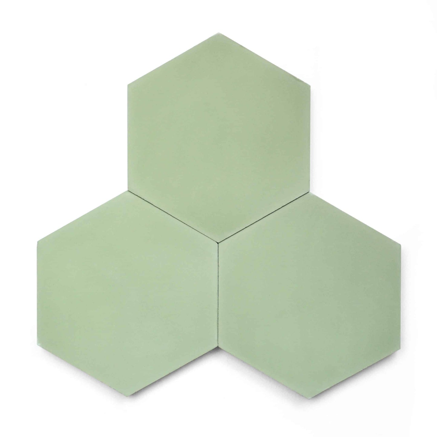 Three Nile Hex tiles in light green are arranged in a clustered hexagonal pattern—one on top and two below—set against a white background.