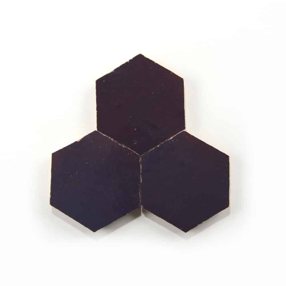 Three Purple Iris Hex samples from Zia Tile, arranged in a triangular cluster on a white background, with one handmade tile on top and two beneath it.