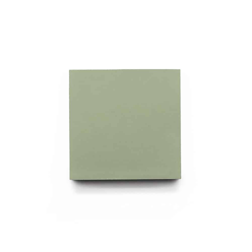 A single green sticky note pad, viewed from above on a plain white background—the shade recalls vendor-unknown’s Saguaro 4x4 sample tile.
