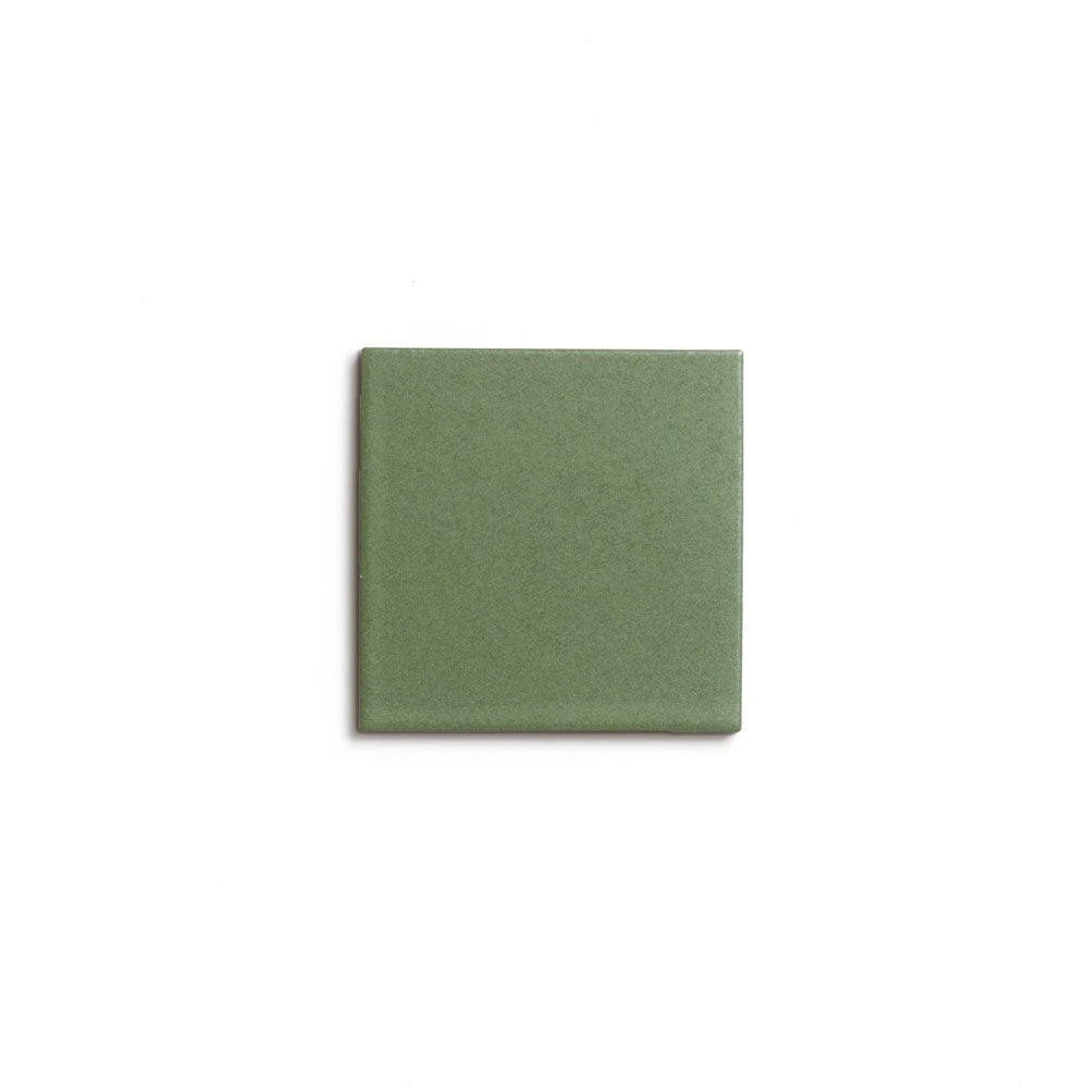 A single Sequoia 4x4 matte ceramic tile by Zia Tile, in green, is centered on a white background.