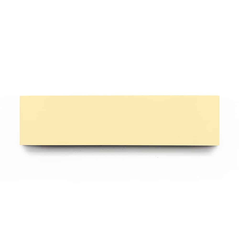 A rectangular, pale yellow sticky note pad sits on a white background—ideal for jotting reminders about your next Solar 2x8 tile project.
