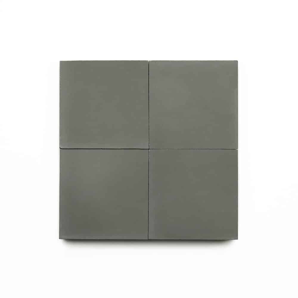 Four matte gray Stone 4x4 cement tiles are arranged in a 2x2 grid on a white background—perfect for kitchen backsplashes or bathroom floors.